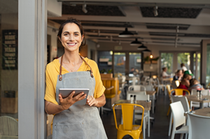 business owner standing outside shop